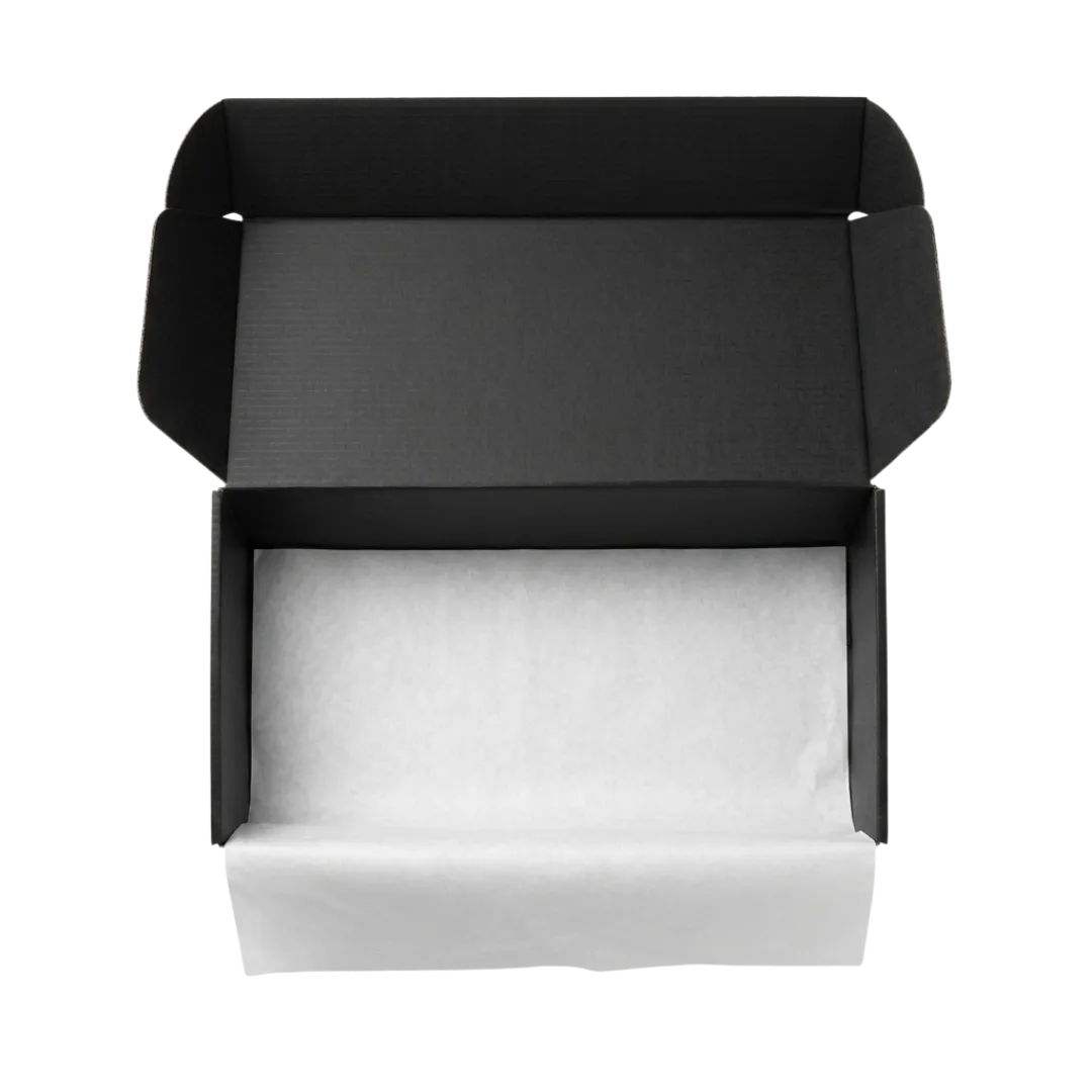 An open black mailer box lined with tissue paper